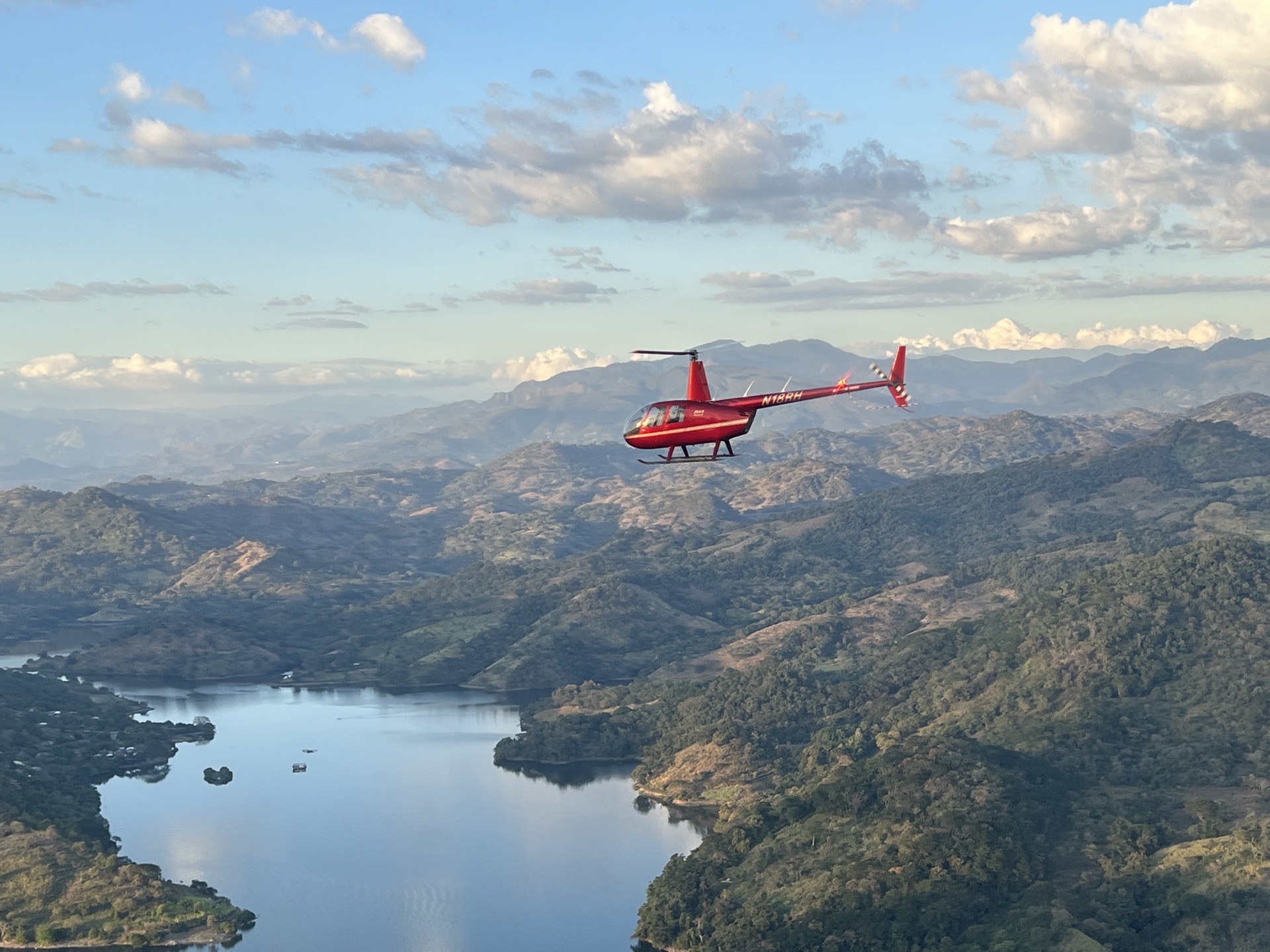 Helicopter over San Salvador skyline with Boqueron volcano